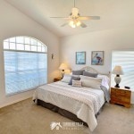 A second master bedroom with a king sized bed and ensuite private bathroom at Sunshine Villa at Glenbrook Resort, a short-term vacation rental home in Orlando near Walt Disney World